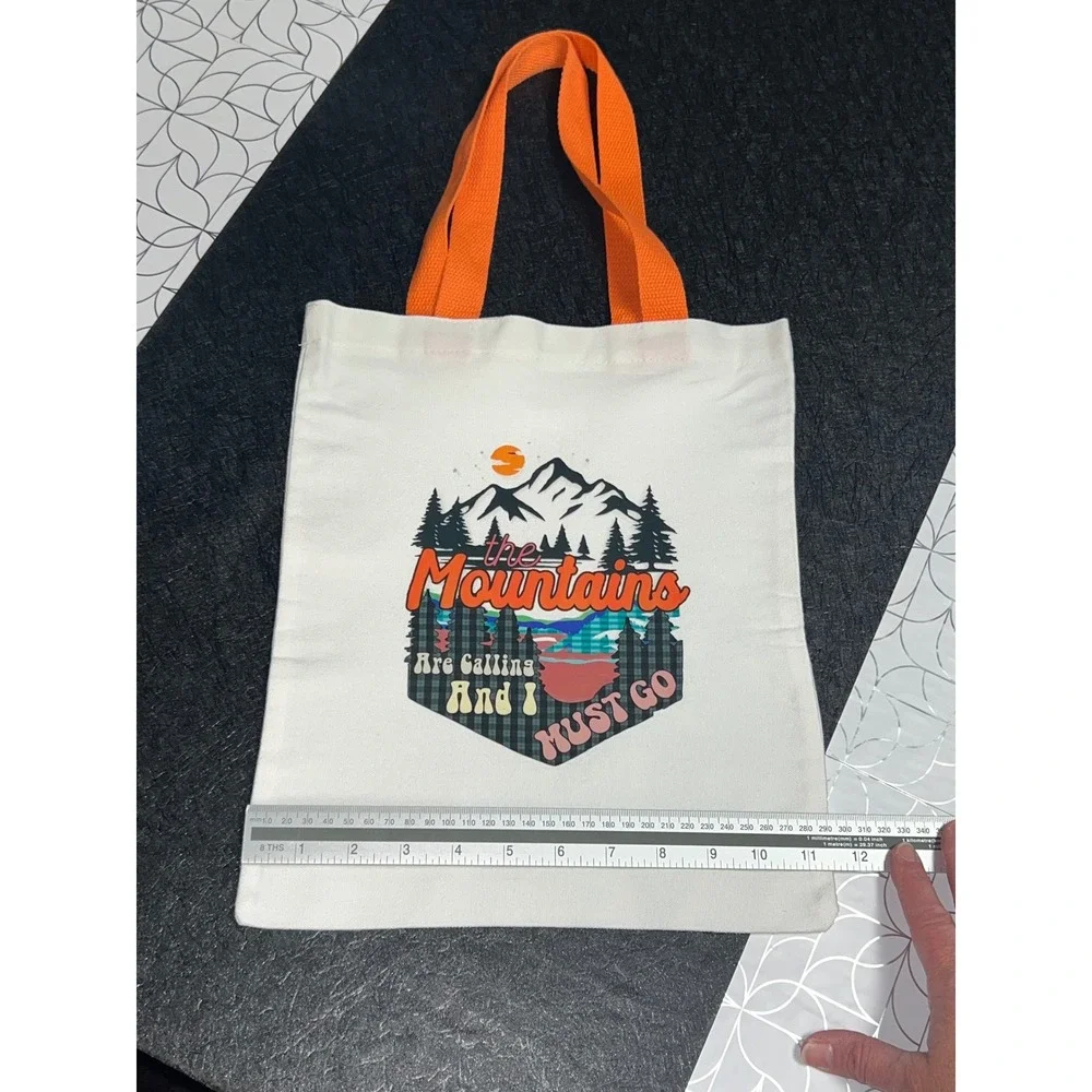 The‎ Mountains Are Calling Graphic Canvas Tote Bag White Orange Trim